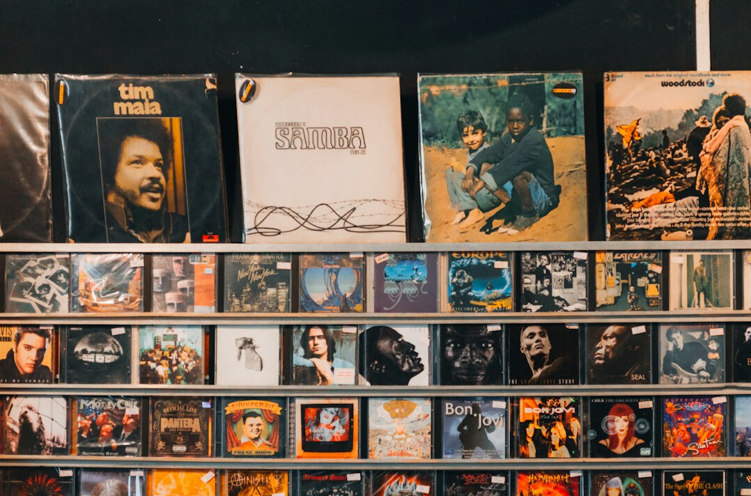 Archive shelves with old posters, VHS tapes and magazines in a media archive